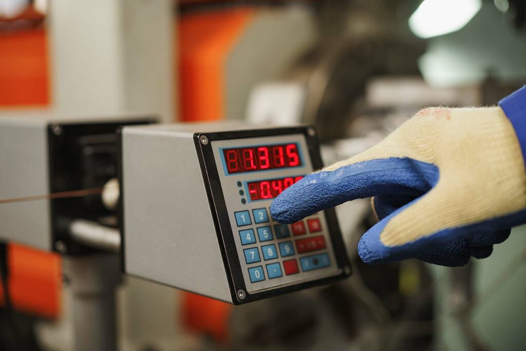 Factory worker shutting down a machine that failed and wasn't being monitored by FactoryAI machine learning software