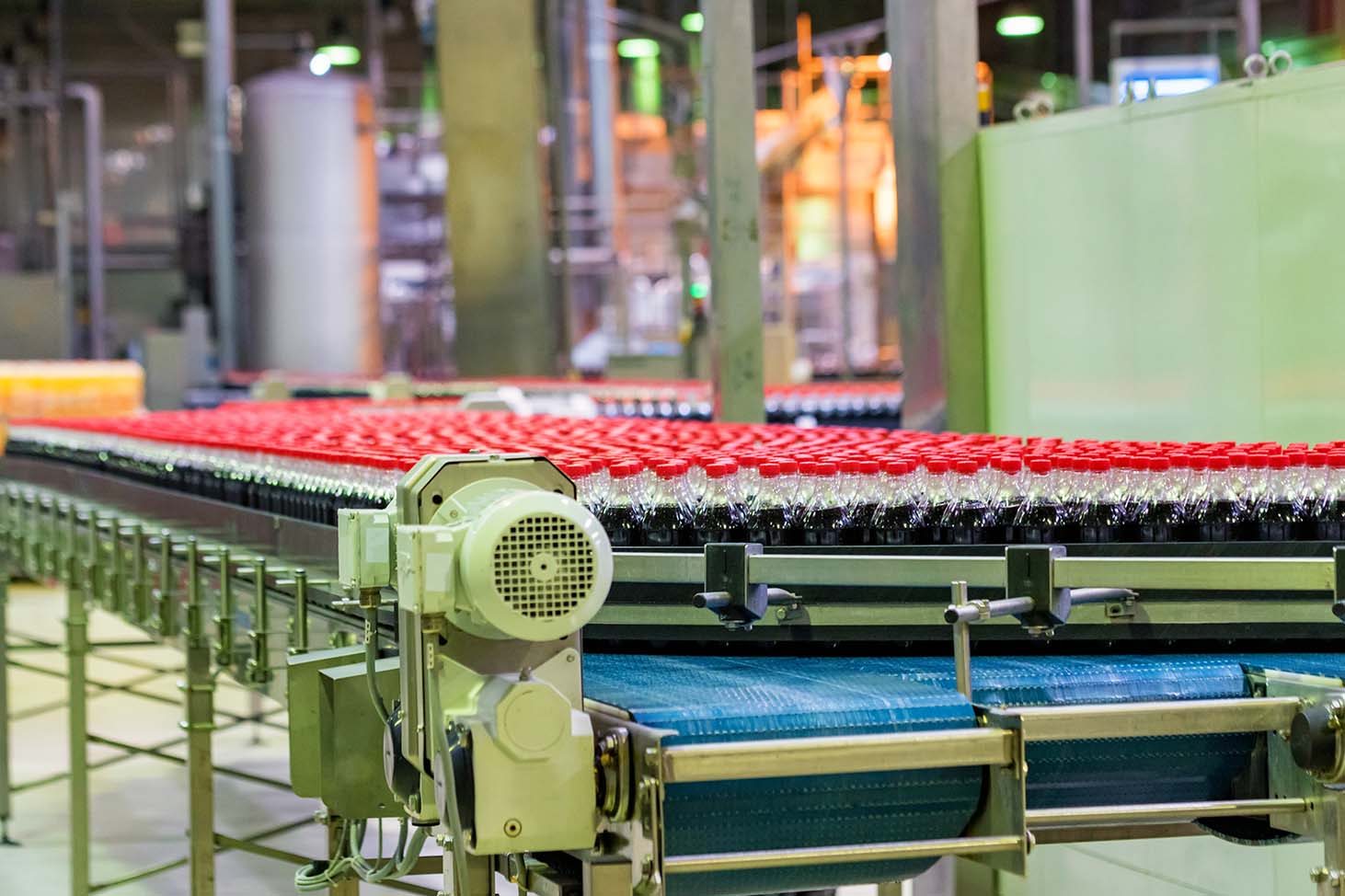 plastic 2 liter bottles on a conveyor belt in a Beverage manufacturing plant